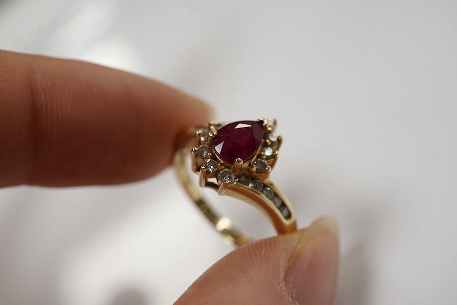 A recent 14k, ruby and diamond cluster set dress ring, size O, gross weight 3.4 grams. Condition - fair to good